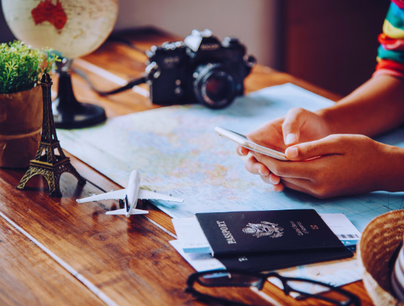 Person Researching Travel Itinerary on Mobile Phone