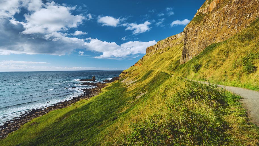 Steep Green Slope with Tourist Path. Ireland.