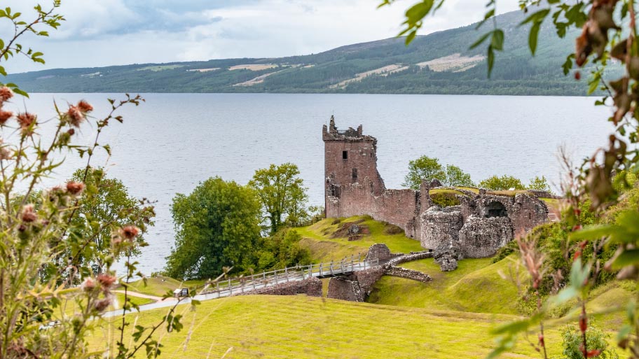 Ruins of Urquhart Castle, on Loch Ness, Scotland, on a summer's day. Concept of tourist attractions in the Scottish Highlands