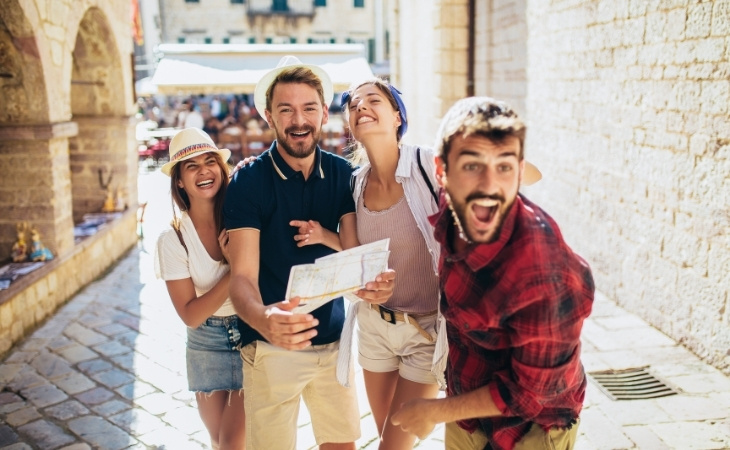 Happy group of tourists traveling and sightseeing