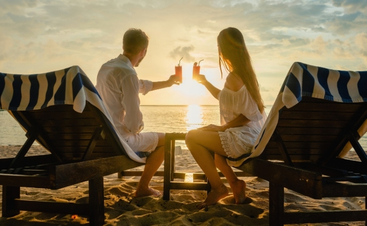 Couple Drinking Cocktails on Beach