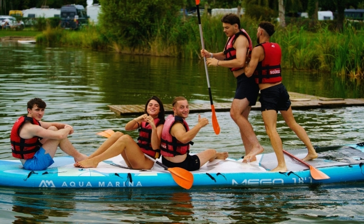 Group Paddle Boarding on a Lake Adventure